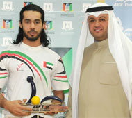 Hareb receiving trophy