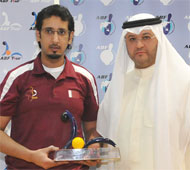 Mansour receiving trophy
